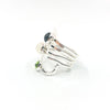 left side view of size 6.75 Sterling Wrap Ring with London Blue Topaz, Moonstone, and Peridot by Judie Raiford