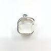 over top view of size 6.75 Sterling Wrap Ring with London Blue Topaz, Moonstone, and Peridot by Judie Raiford