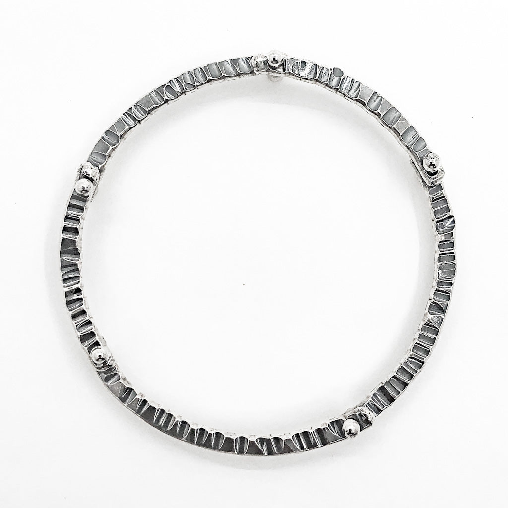 over top view of Oxidized Sterling Industrial Bangle by Judie Raiford