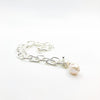 side angle view of Junior Tow Truck Necklace with 14k Dangle and Large Baroque Pearl by Judie Raiford