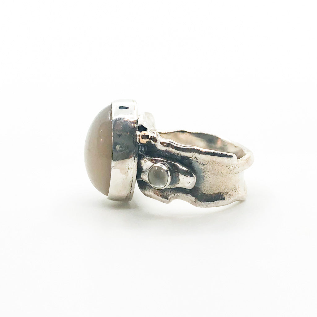 right side view of Sterling and 14k Anticlastic Deckled Edge Moonstone Ring by Judie Raiford