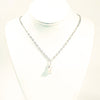 White Baroque Pearl on Sterling Long Short Chain by Judie Raiford on white jewelry display bust