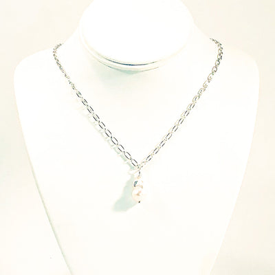 White Baroque Pearl on Sterling Long Short Chain by Judie Raiford on white jewelry display bust