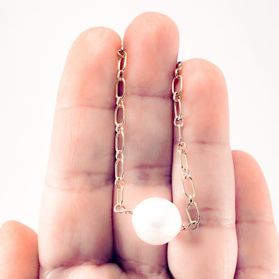Single White Pearl on 14k Gold Filled Long Short Chain by Judie Raiford held in hand