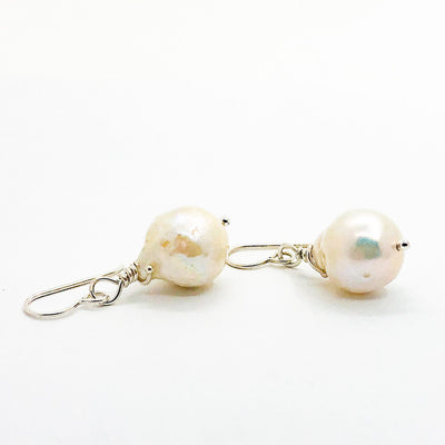 side angle view of Large White Baroque Pearl Earrings by Judie Raiford