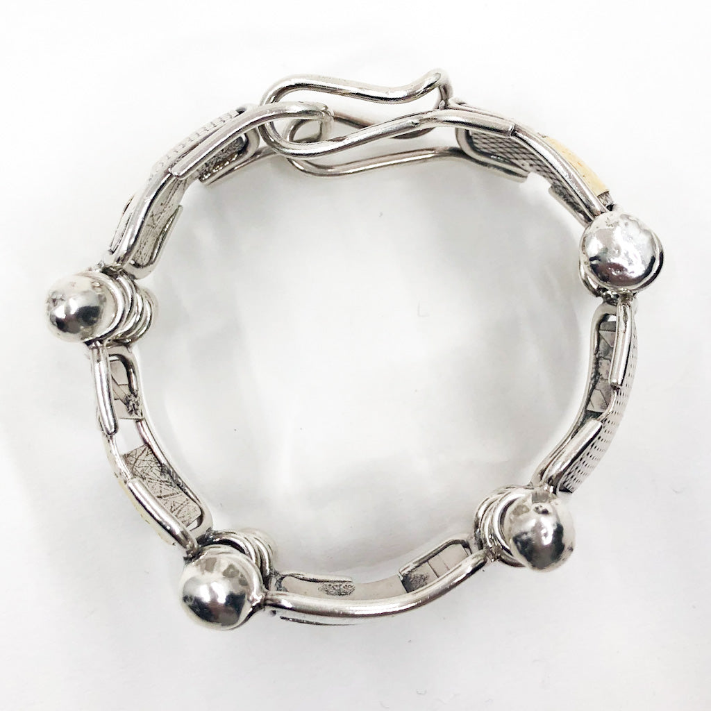 over top view of Sterling and 24k J Edgar Bracelet by Judie Raiford