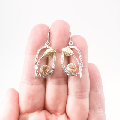 Sterling and 22k Citrine Small Oval Leaf Hook Earrings by Donna Burdic held in hand
