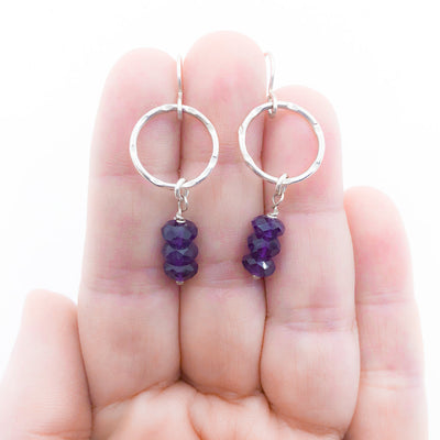 Sterling Circle Drop Earrings with Amethyst by Berlin Randall held in hand