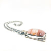 side angle view of Sterling Cherry Quartz Mandala Necklace by Berlin Randall