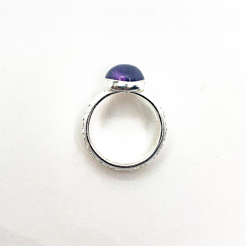 over top view of size 6.5 Sterling Princess Ring with Amethyst by Berlin Randall