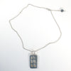 flat lay of Windows of Opportunity Necklace by Ling-Yen Jones