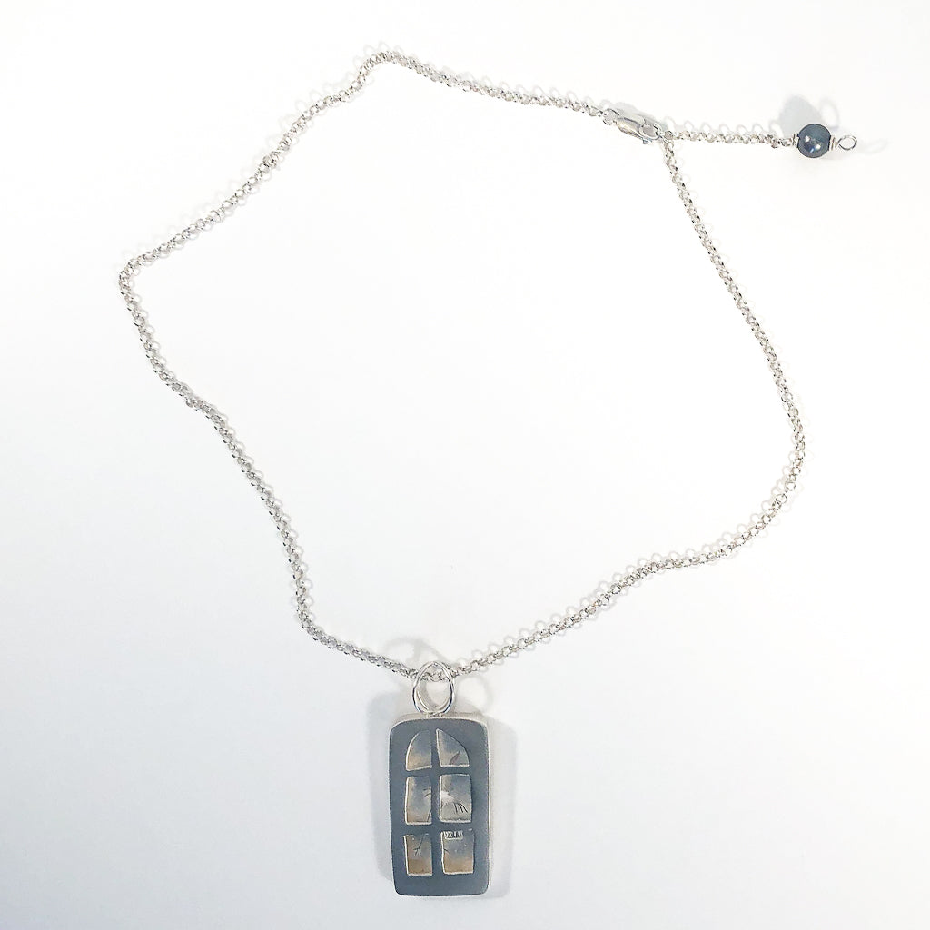 flat lay of Windows of Opportunity Necklace by Ling-Yen Jones