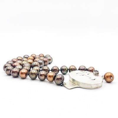 side angle flat lay of Sunstone Necklace with Bronze Pearls and Unmentionables Clasp by Ling-Yen Jones