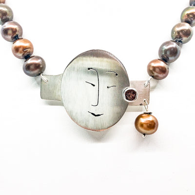 detail view of Sunstone Necklace with Bronze Pearls and Unmentionables Clasp by Ling-Yen Jones