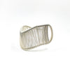 left side view of Sterling Asymmetrical L Wave Cuff by Tana Acton