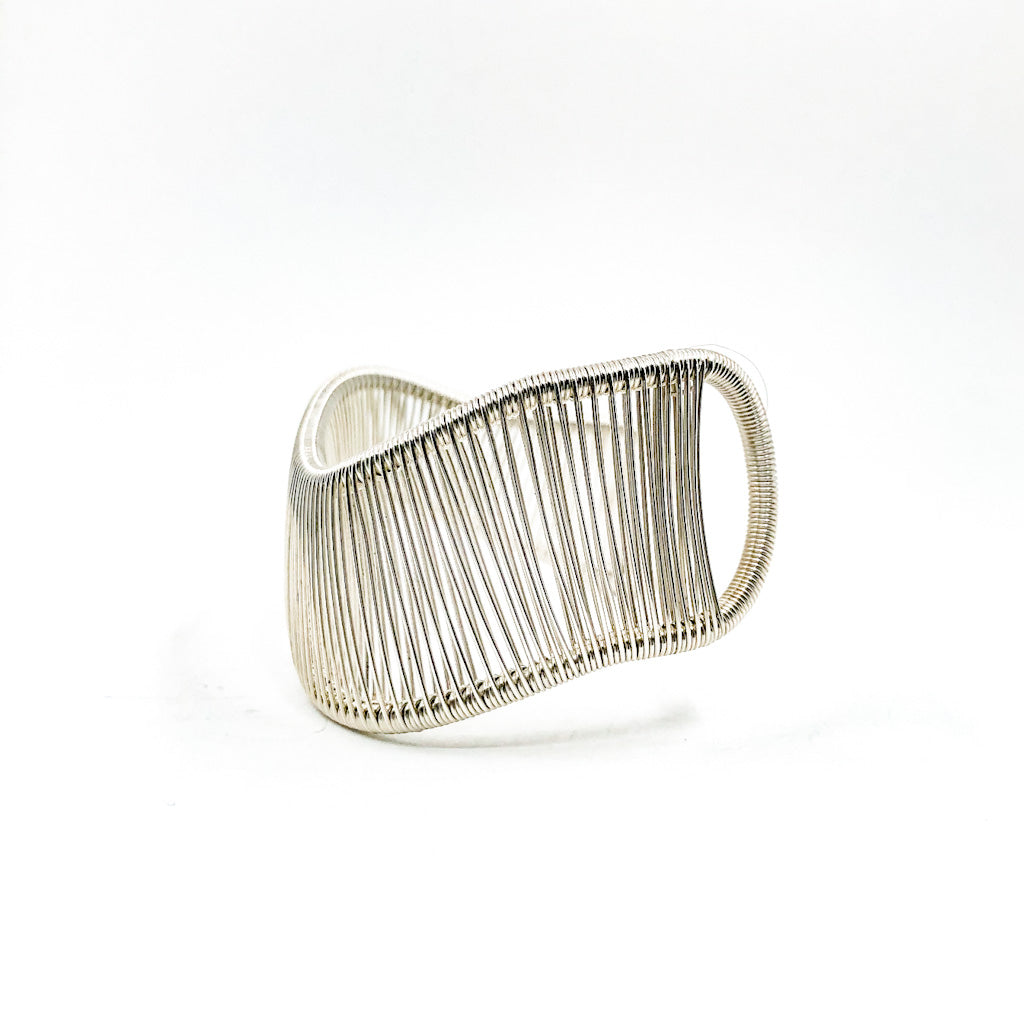 left side view of Sterling Asymmetrical L Wave Cuff by Tana Acton
