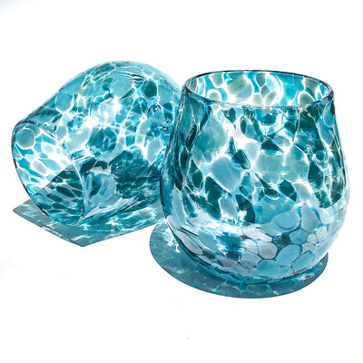 pair of Teal Speckled Wine Tumblers by Nate Nardi against white background with colorful shadows reflecting