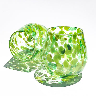 pair of Spring Green Wine Tumblers by Nate Nardi against white backdrop with colorful cast shadows