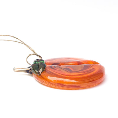 side angle view of Handblown Glass Peach Ornament by Nate Nardi