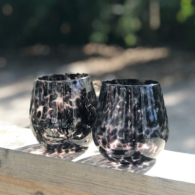 pair of Black Speckled Wine Tumblers by Nate Nardi in outdoor setting