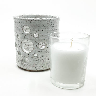 glass votive with candle along side pottery Votive Holder by Terrie Ponder Watch