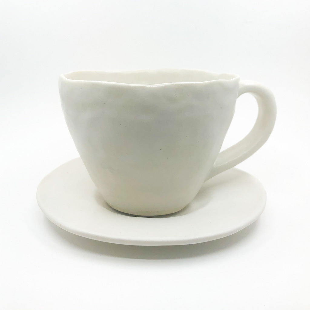 White Latte Cup and Saucer by Nona Kelhofer