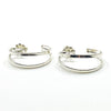 side angle view of Sterling Looped End Earrings by Judie Raiford