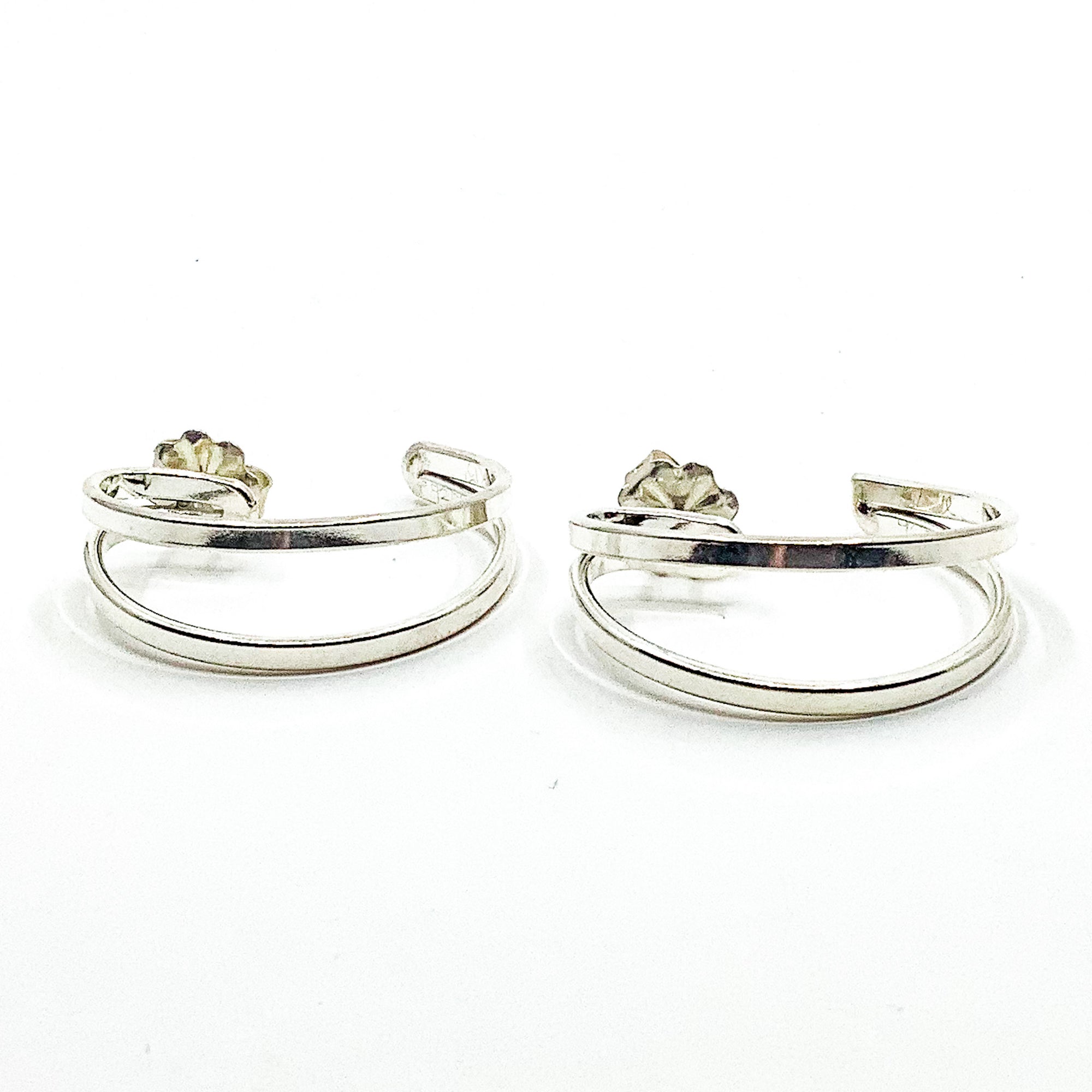 side angle view of Sterling Looped End Earrings by Judie Raiford