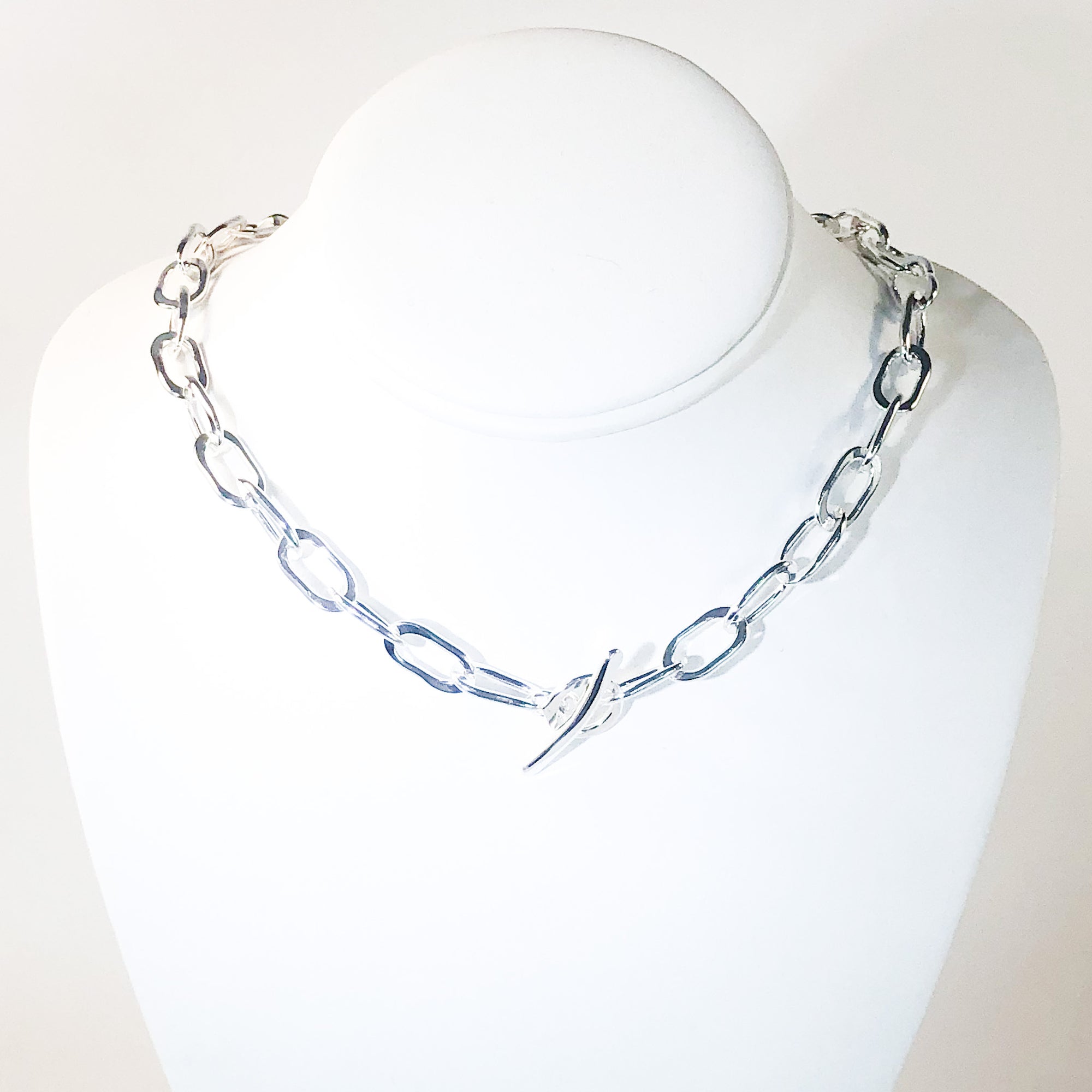 Sterling Junior Tow Truck Necklace by Judie Raiford on mannequin bust